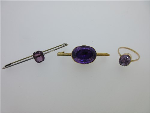 Lot 54 - An antique amethyst brooch and two other purple hardstone jewels