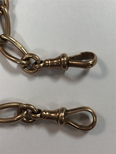 Lot 441 - An Edwardian 9ct rose gold double Albert watch chain