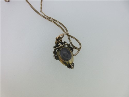 Lot 123 - A Victorian garnet carbuncle and diamond pendant together with a diamond ring