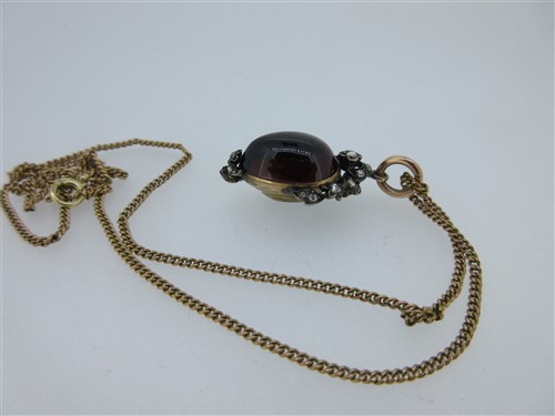 Lot 123 - A Victorian garnet carbuncle and diamond pendant together with a diamond ring