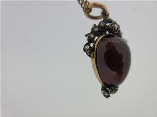 Lot 123 - A Victorian garnet carbuncle and diamond pendant together with a diamond ring