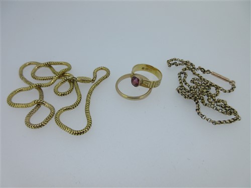 Lot 171 - An 18ct gold ring set with a light pyrope garnet together with a wedding band and two chains