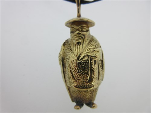 Lot 39 - A cast Chinaman pendant