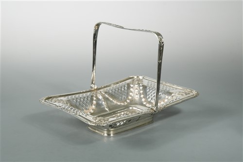 Lot 642 - An Edward VII silver swing handled cake basket