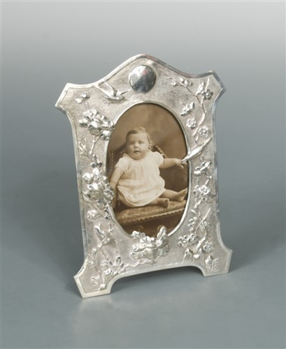 Lot 524 - A Chinese export metalwares easel back photograph frame