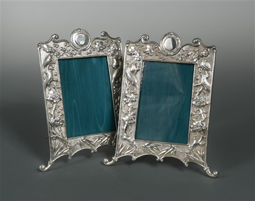 Lot 525 - A pair of Chinese export metalwares easel back photograph frames