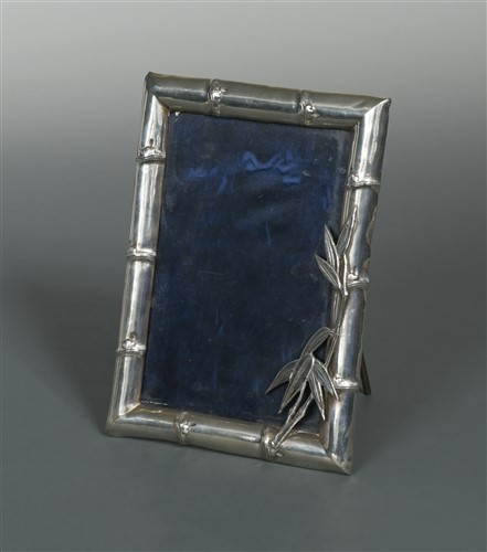 Lot 526 - A Chinese export metalwares easel back photograph frame