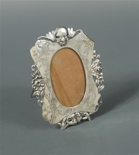 Lot 527 - A Chinese export metalwares easel back photograph frame