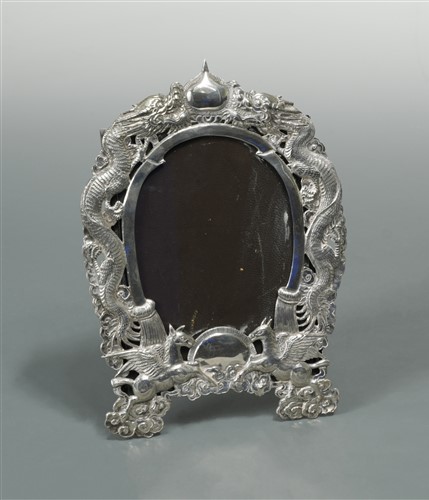 Lot 528 - A Chinese export metalwares easel back photograph frame