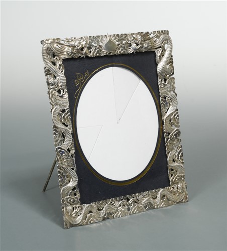 Lot 529 - A Chinese export metalwares easel back photograph frame