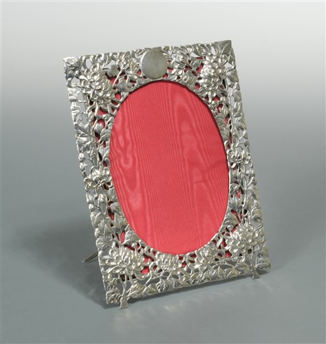 Lot 530 - A Chinese export metalwares easel back photograph frame