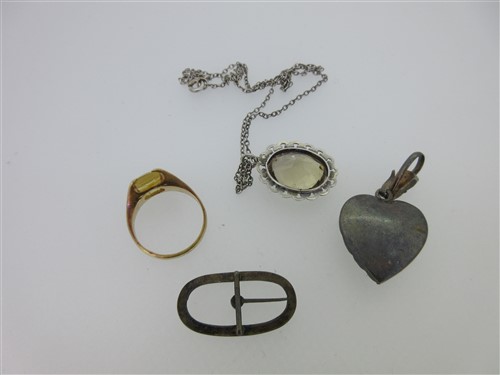 Lot 78 - A vintage paste set heart pendant, a citrine pendant and two other citrine or paste pieces