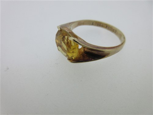 Lot 78 - A vintage paste set heart pendant, a citrine pendant and two other citrine or paste pieces