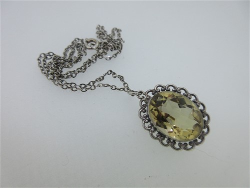 Lot 78 - A vintage paste set heart pendant, a citrine pendant and two other citrine or paste pieces