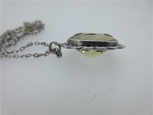 Lot 78 - A vintage paste set heart pendant, a citrine pendant and two other citrine or paste pieces