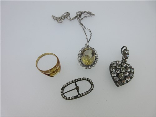 Lot 78 - A vintage paste set heart pendant, a citrine pendant and two other citrine or paste pieces