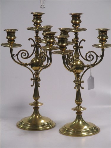 Lot 177 - A pair of mid 19th century brass candlesticks