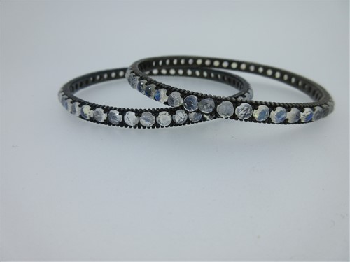 Lot 232 - A pair of bangles set all around with faceted labradorites