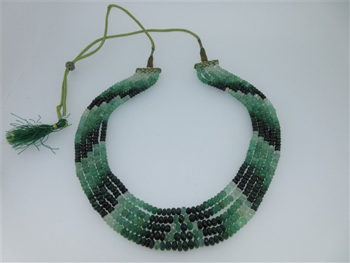 Lot 263 - An Indian five strand bead necklace of emeralds and other green gems