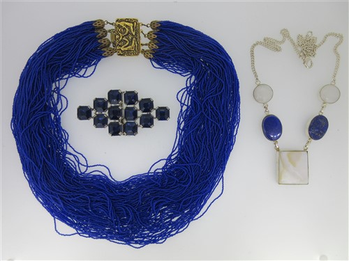 Lot 129 - A blue collection  featuring a 100 strand fine bead necklace and other gem and paste pieces