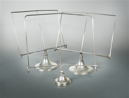 Lot 499 - Asprey - A pair of early 20th century electroplated silver table menu/music stands, and another