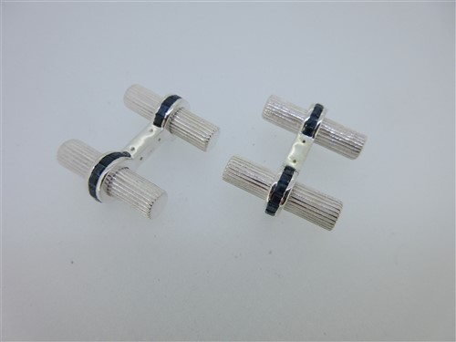 Lot 158 - A pair of sapphire set double ended baton cufflinks
