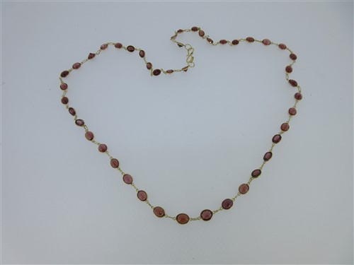 Lot 127 - A necklace of spectacle set garnets