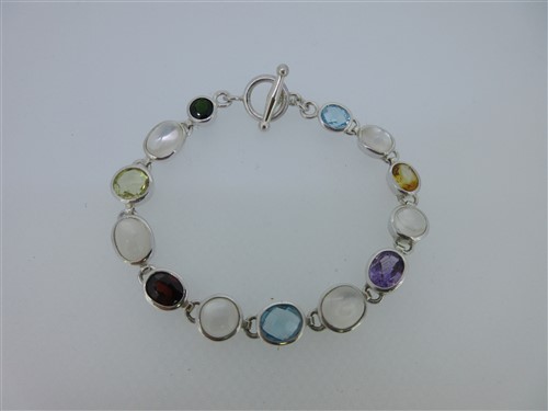 Lot 107 - A modern moonstone and multi gem set bracelet