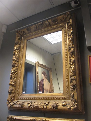 Lot 459 - A gesso gilded portrait frame with mirror,...