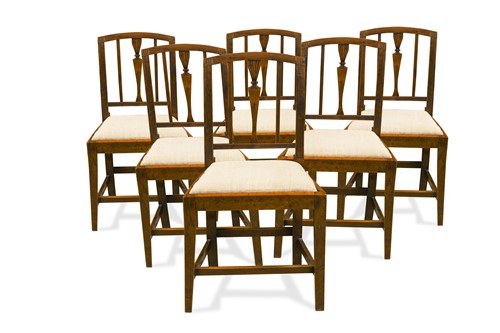 Lot 282 - A set of six late George III Sheraton yew wood dining chairs