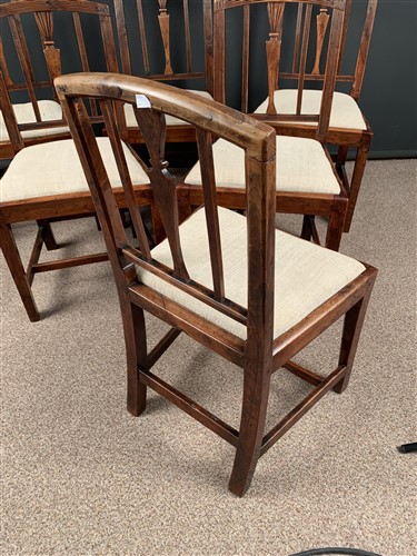 Lot 568 - A set of six late George III Sheraton yew wood dining chairs