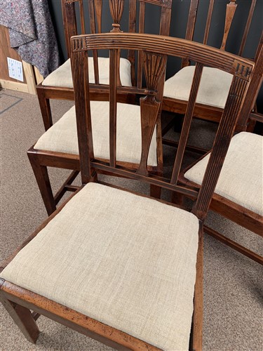 Lot 568 - A set of six late George III Sheraton yew wood dining chairs