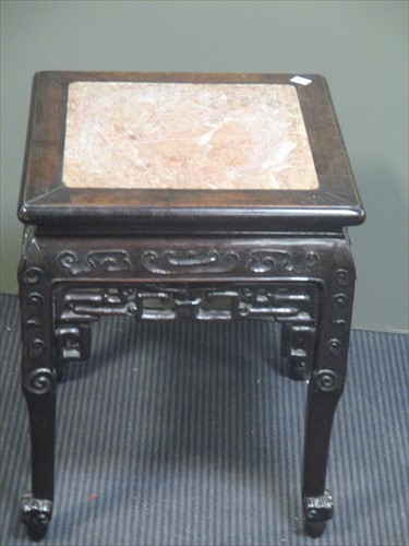 Lot 565 - A Chinese hardwood stand, 48cm high