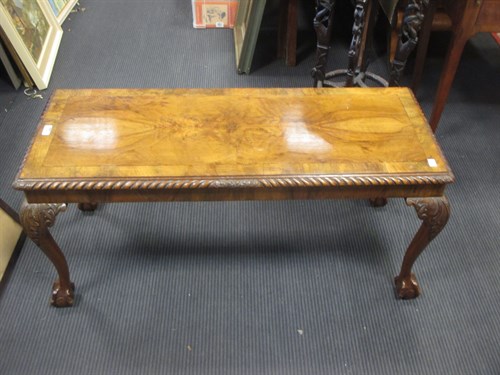 Lot 373 - A walnut rectangular coffee table with cross...