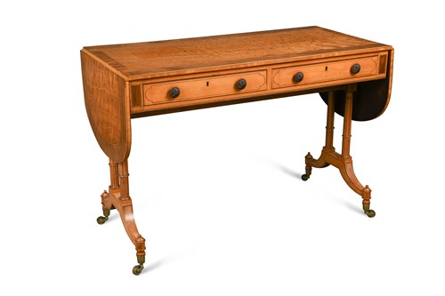 Lot 519 - A Regency satinwood sofa table