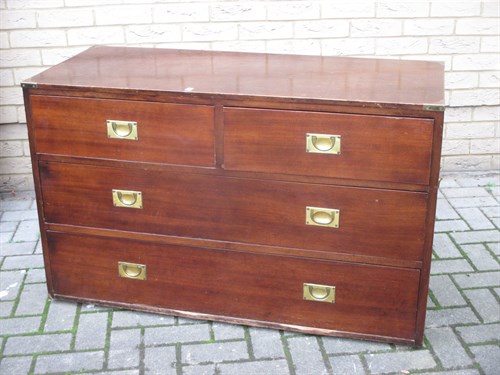 Lot 634 - A military type low chest of drawers with...
