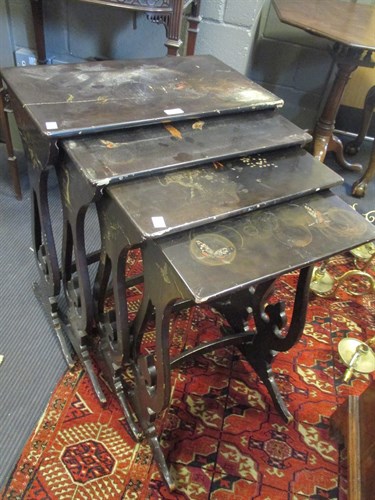 Lot 522 - A nest of four papier mache occasional tables