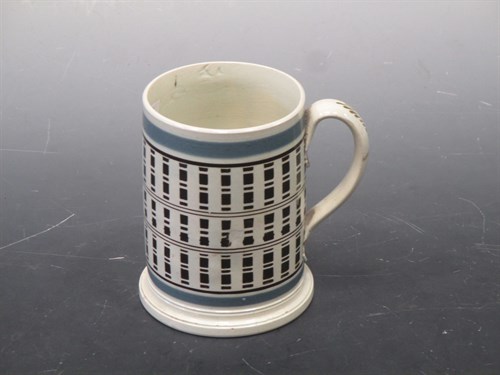 Lot 38 - A late 18th century creamware frog mug, with...