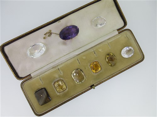 Lot 50 - An amethyst brooch and a quantity of loose large faceted gemstones