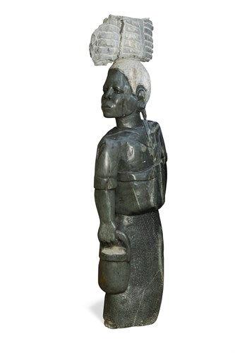 Lot 15 - A large Zimbabwean carved green stone figure of a lady