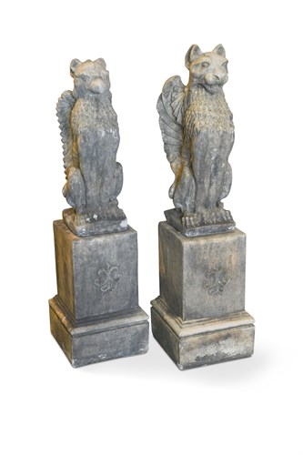 Lot 7 - A pair of reconstituted stone griffins