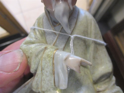 Lot 1 - Two Chinese porcelain figures of seated sages,...