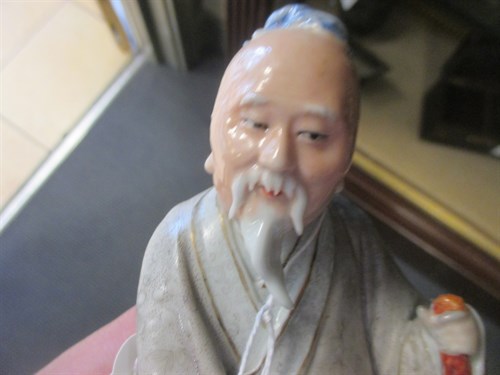 Lot 1 - Two Chinese porcelain figures of seated sages,...