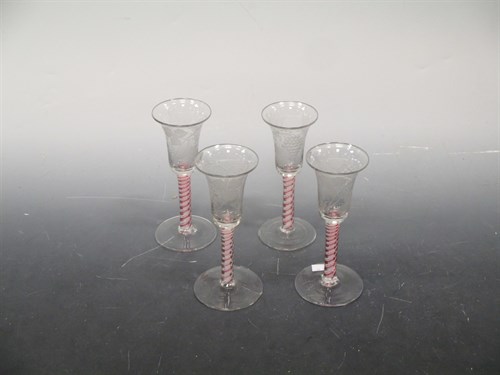 Lot 32 - A set of four Dutch colour twist wine glasses,...