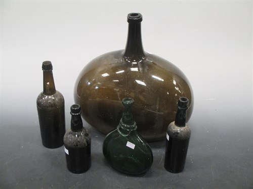 Lot 41 - A group of glass bottles: A carboy of...
