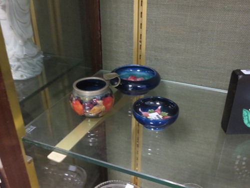Lot 16 - Three small Moorcroft pieces to include an...