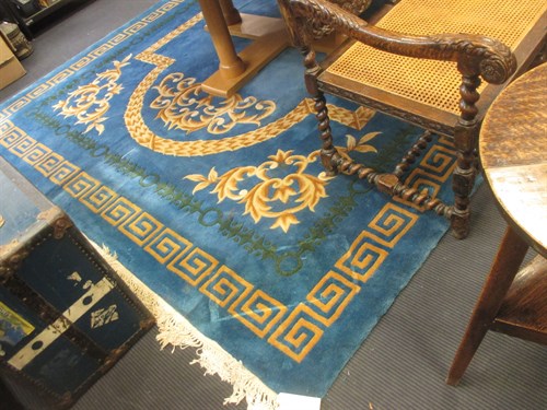 Lot 417 - A blue ground patterned Chinese wool rug,...