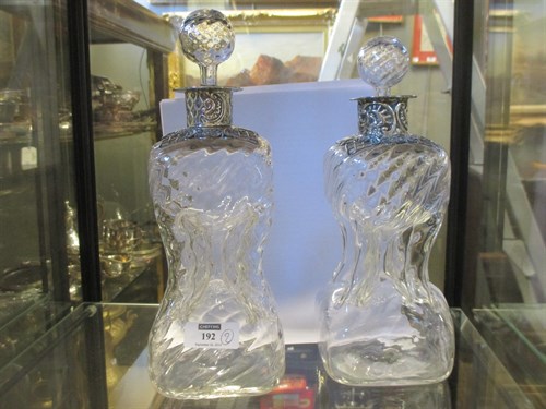 Lot 192 - A pair of Edwardian white metal collared...