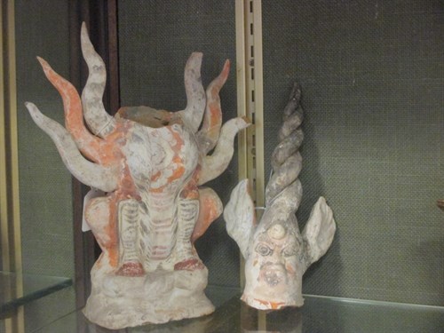 Lot 21 - A painted pottery figure of an earth spirit...