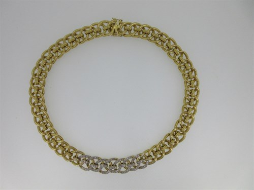 Lot 306 - Cartier - A gold and diamond set collar